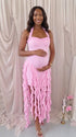 pink ruffle maternity dress with halter neckline and asymmetrical frill hem