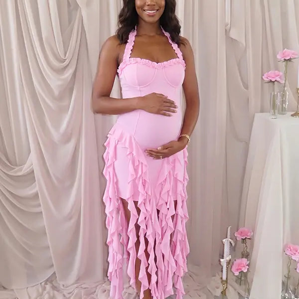 pink ruffle maternity dress with halter neckline and asymmetrical frill hem