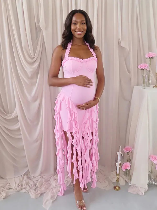 pink ruffle maternity dress with halter neckline and asymmetrical frill hem