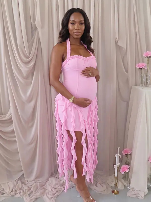 pink ruffle maternity dress with halter neckline and asymmetrical frill hem