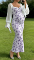 Pregrant showing baby bump in purple floral maternity dress
