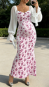 Pregrant showing baby bump in red floral maternity dress