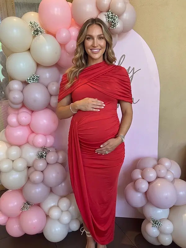 red ruched maternity midi dress with matching shawl and bodycon silhouette