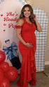 Red ruffle halter maternity maxi dress with ruched bodycon fit and flowing high-low hem