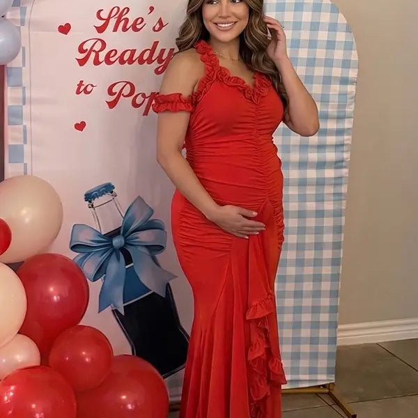 Red ruffle halter maternity maxi dress with ruched bodycon fit and flowing high-low hem