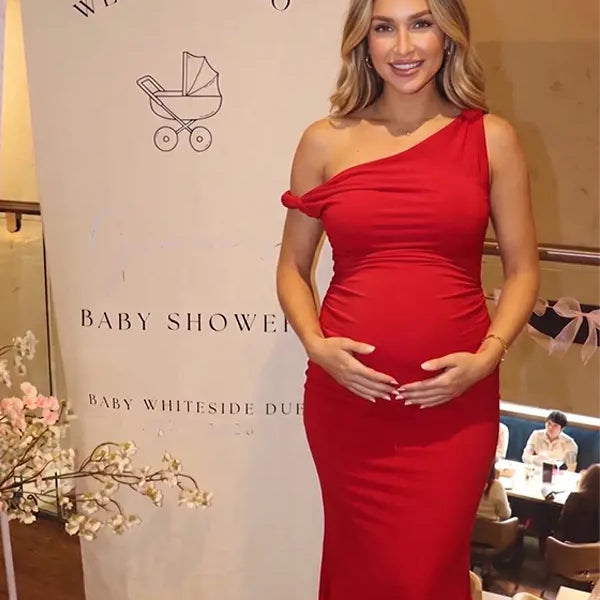 red solid off shoulder maternity maxi dress with bodycon silhouette