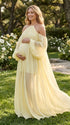 Pregnant woman wearing light yellow maternity dress for baby shower party