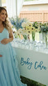 Sky blue boho pleated maternity maxi dress with cascading ruffle details for beach maternity photoshoots