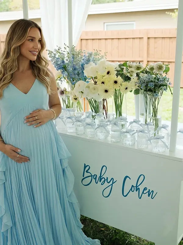 Sky blue boho pleated maternity maxi dress with cascading ruffle details for beach maternity photoshoots