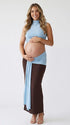 sky blue maternity crop top set with open belly design and draped maxi skirt for maternity photoshoot