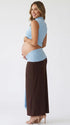 sky blue maternity crop top set with open belly design and draped maxi skirt for maternity photoshoot
