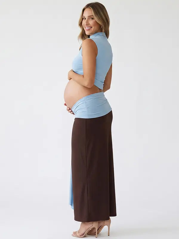 sky blue maternity crop top set with open belly design and draped maxi skirt for maternity photoshoot