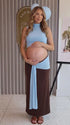 sky blue maternity crop top set with open belly design and draped maxi skirt for maternity photoshoot