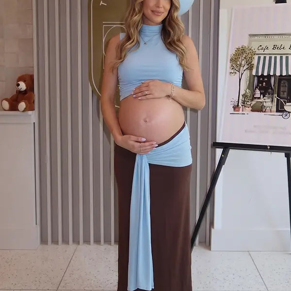 sky blue maternity crop top set with open belly design and draped maxi skirt for maternity photoshoot