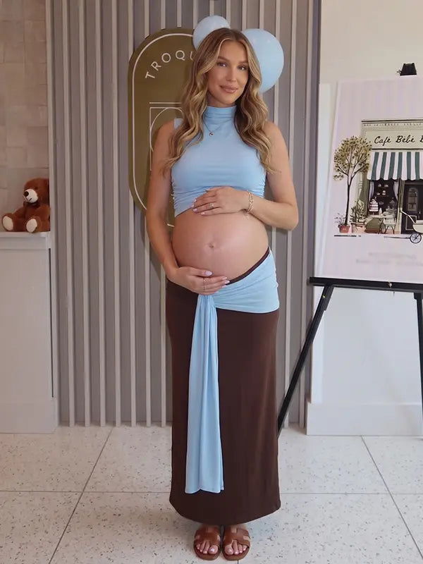 sky blue maternity crop top set with open belly design and draped maxi skirt for maternity photoshoot