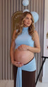 sky blue maternity crop top set with open belly design and draped maxi skirt for maternity photoshoot