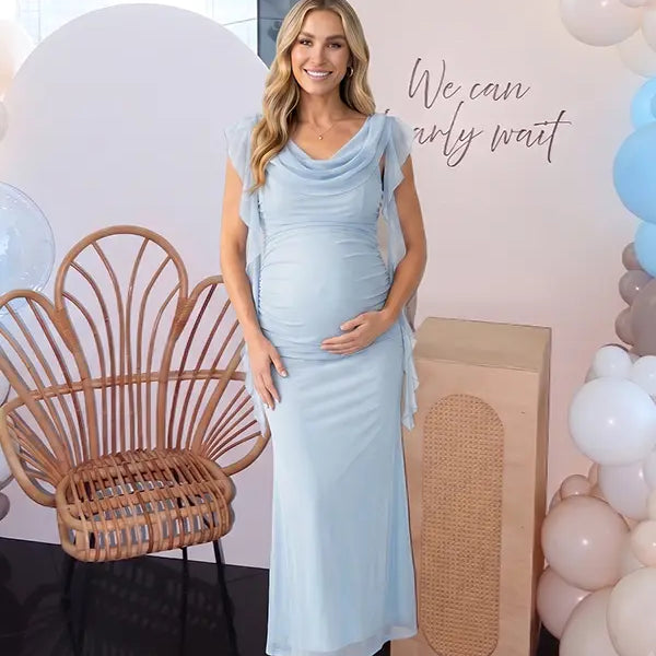 sky blue mesh maternity gown with draped cowl neckline and cascading ruffle sleeves