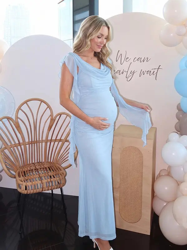 sky blue mesh maternity gown with draped cowl neckline and cascading ruffle sleeves