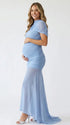 dusty blue ruched maternity gown with mesh overlay short sleeves and sweep train