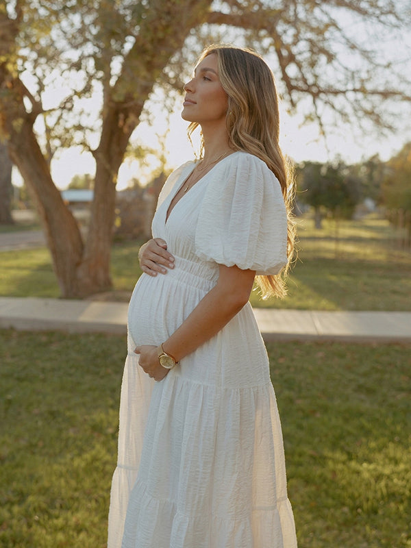 White v neck maternity maxi dress for baby shower, gender reveal and maternity photoshoot.