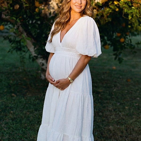 White v neck maternity maxi dress for baby shower and maternity photoshoot.