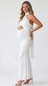 white halter maternity maxi dress with ruched bodycon silhouette and cross neck detail