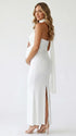 white halter maternity maxi dress with ruched bodycon silhouette and cross neck detail