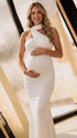 white halter maternity maxi dress with ruched bodycon silhouette and cross neck detail