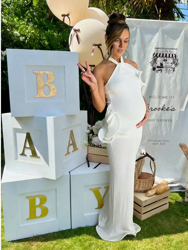white halter maternity maxi dress with ruffle detail for baby shower outdoor photoshoot