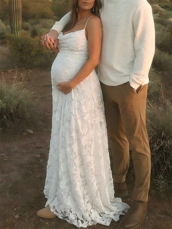 Pregnant woman wearing white floral open back maternity dress for baby shower
