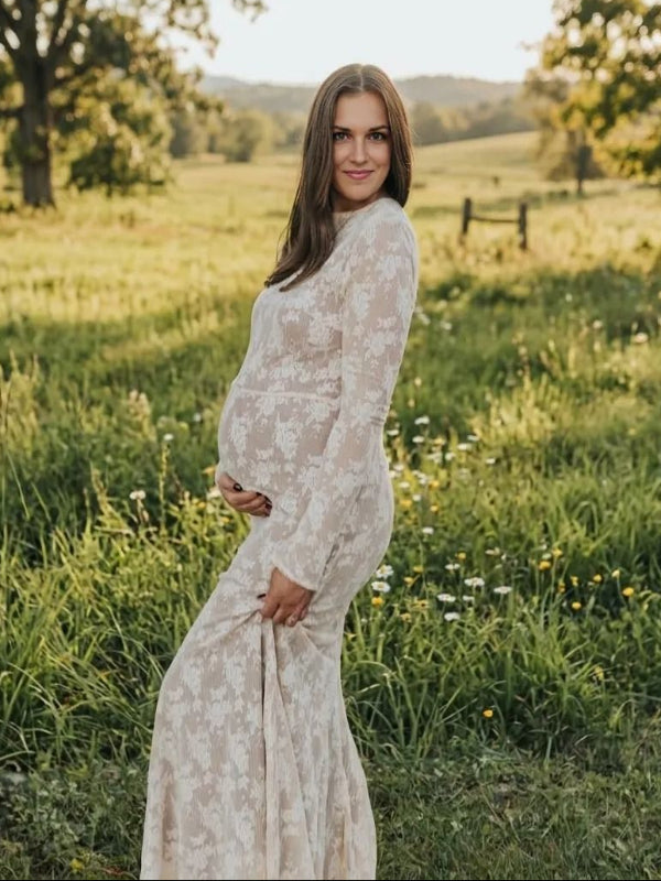 Pregnant woman wearing  elegant white maternity maxi dress for maternity photoshoot outdoors
