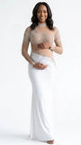 A white long sleeve rhinestone illusion mesh maternity mermaid maxi dress for luxury maternity photoshoots, baby showers, pregnancy announcements, and elegant formal events.