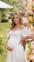 White Eyelet Maternity Midi Dress, Off Shoulder Pregnancy Dress with Flutter Sleeves and Scalloped Hem | Bumplook
