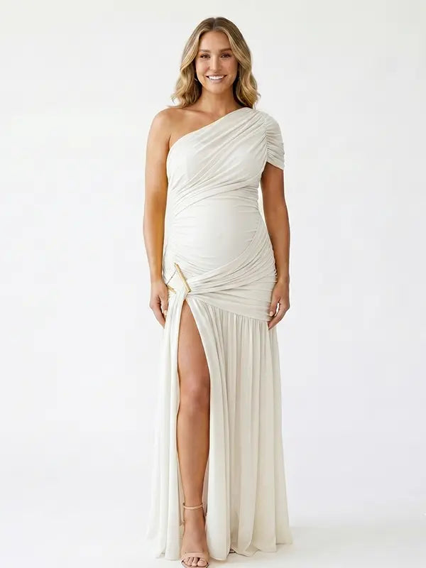 White one shoulder goddess maternity gown with ruched bodice and flowing mesh skirt