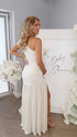 White one shoulder goddess maternity gown with ruched bodice and flowing mesh skirt