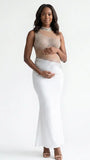 A white rhinestone illusion mesh maternity mermaid maxi dress for luxury maternity photoshoot, baby shower, editorial portrait, and pregnancy announcement.