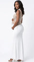 A white rhinestone illusion mesh maternity mermaid maxi dress for luxury maternity photoshoot, baby shower, editorial portrait, and pregnancy announcement.