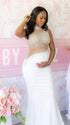A white rhinestone illusion mesh maternity mermaid maxi dress for luxury maternity photoshoot, baby shower, editorial portrait, and pregnancy announcement.