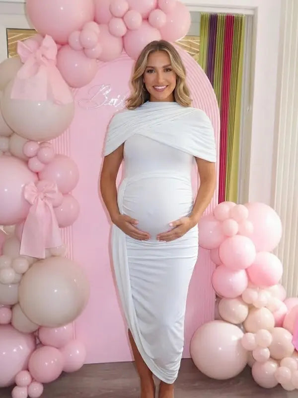white ruched maternity midi dress with matching shawl and bodycon silhouette