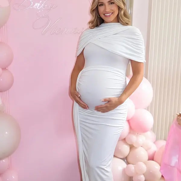 white ruched maternity midi dress with matching shawl and bodycon silhouette