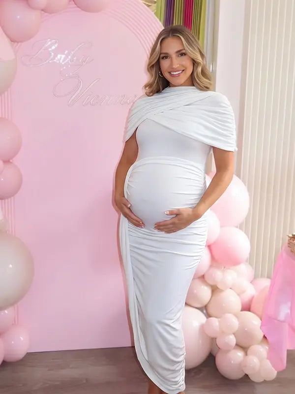 white ruched maternity midi dress with matching shawl and bodycon silhouette