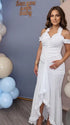 White ruffle halter maternity maxi dress with flattering ruching and high-low hem for baby shower photoshoot