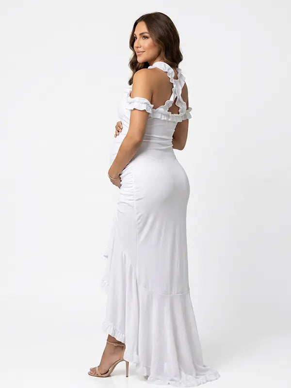 White ruffle halter maternity maxi dress with flattering ruching and high-low hem for baby shower photoshoot