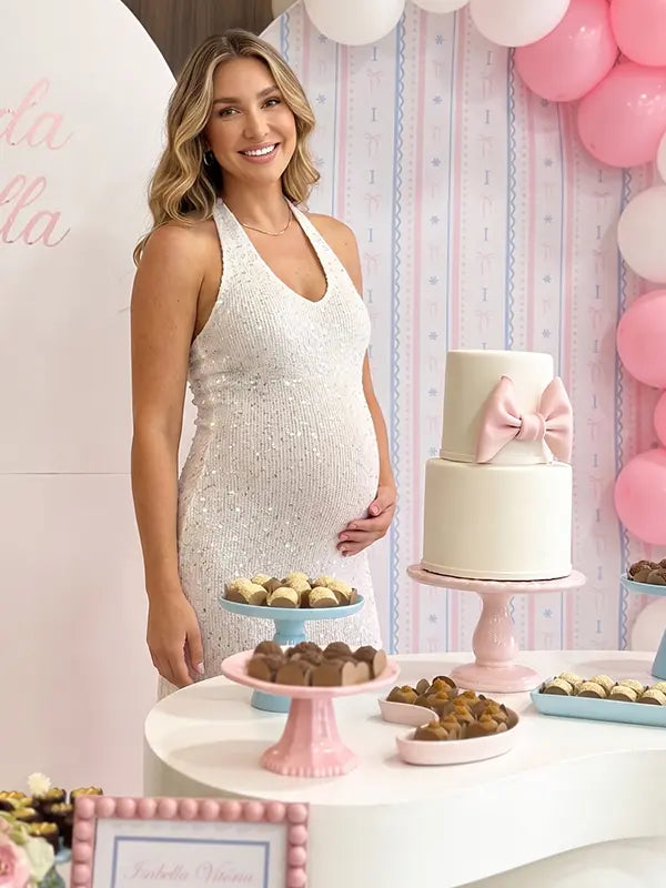 white sequin fringe maternity midi dress with halter neckline and open back