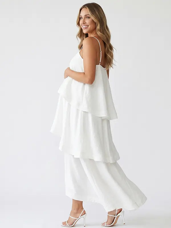 white tiered ruffle maternity maxi dress with spaghetti straps and layered ruffles