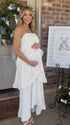 white tiered ruffle maternity maxi dress with spaghetti straps and layered ruffles