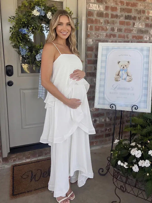 white tiered ruffle maternity maxi dress with spaghetti straps and layered ruffles