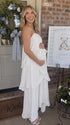 white tiered ruffle maternity maxi dress with spaghetti straps and layered ruffles