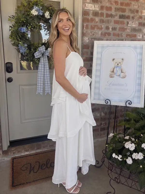white tiered ruffle maternity maxi dress with spaghetti straps and layered ruffles