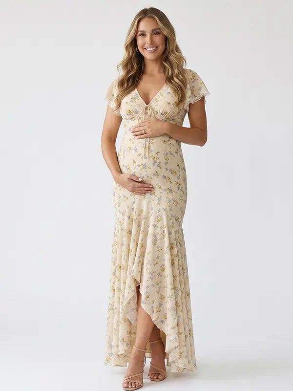 yellow floral maternity maxi dress with flutter sleeves and high low hem